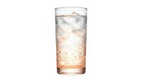 Tall glass filled with cola or cola-based soft drink with ice cubes and carbonated bubbles, isolated on white background, ready for beverage, restaurant, and food service design projects.