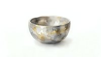 Metallic bowl with gold and silver finish, isolated on white background, suitable for home decor, product design, and luxury lifestyle applications.