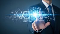 Professional businessman in suit presenting digital technology interface with glowing gears, circuits and data visualization for innovation concepts.
