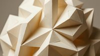 Abstract geometric paper sculpture with angular faceted forms creating dimensional shadows and highlights in warm neutral tones for modern design projects.