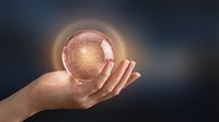 Caucasian woman's hand holding glowing crystal ball with golden light and circuit pattern inside, symbolizing future technology, artificial intelligence, and digital innovation for business concepts.