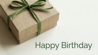 Kraft paper gift box with green ribbon bow and Happy Birthday text on light background, eco-friendly present for celebration greeting card.