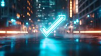 Glowing neon blue checkmark arrow symbol floating above wet reflective city street at night with blurred urban lights and buildings in background.