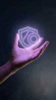 Male hand holding glowing neon camera shield icon against dark background, representing digital security, data protection, and photography technology innovation.