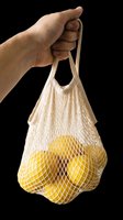Hand holding a cotton mesh bag with fresh lemons, isolated on transparent background. Ready for stickers, print on demand, sublimation, and t-shirt design use.