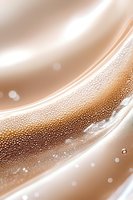 Luxurious beige and cream abstract background with sparkling bubbles and flowing silk-like waves creates elegant atmosphere for luxury product presentations.