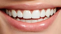 Close up view of healthy white teeth and pink lips showing natural smile with perfect dental care and oral hygiene for dentistry and healthcare concept.