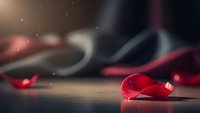 Red gemstone with sparkling light effects on wooden surface creating luxury jewelry and precious stone concept for elegant design projects.