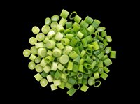 Chopped green onions pile isolated on transparent background, fresh scallion slices for food clipart, t-shirt design, stickers, print on demand, and sublimation use.