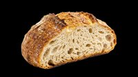 Freshly baked artisan bread loaf with golden crust and soft interior, isolated on transparent background. Ready for bakery designs, food packaging, menus, print-on-demand products and culinary graphics.