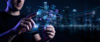 Young businessman touching holographic digital interface with floating data cubes and network connections in futuristic technology concept for innovation.