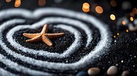 Decorative copper starfish on black sand with white spiral pattern and golden bokeh lights in background creates zen garden atmosphere for spa and wellness design.