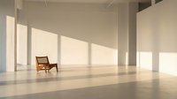 Minimalist modern interior with single wooden chair in empty white room with natural sunlight streaming through windows creating geometric shadows on polished floor.