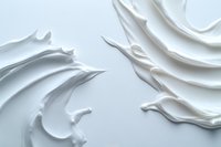 White creamy texture with smooth swirls and waves creating an abstract minimalist pattern on light background, cosmetic cream or moisturizer surface detail.