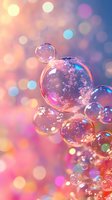 Delicate soap bubbles floating against dreamy pink and blue bokeh background, with iridescent reflections creating magical atmosphere for fairy tale designs.