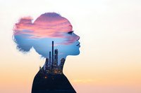 Female silhouette double exposure with industrial cityscape and dramatic sunset sky, combining urban development and natural beauty in artistic composition.