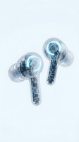 Transparent wireless earbuds with glowing blue LED lights and visible internal circuitry, isolated on white background for tech product design and audio equipment marketing.