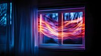Glowing neon light trails through window at night with blue curtains, creating ethereal aurora-like effect against dark background. Artistic long exposure photography.
