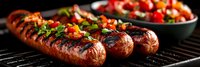 Grilled bratwurst sausages with fresh herb garnish on barbecue grill grates, perfect for summer cookouts and outdoor dining experiences.