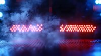 Atmospheric red LED lights glowing through dramatic fog with blue accent lighting creates moody nightclub ambiance, abstract background pattern.