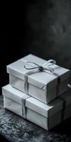 White gift boxes with silver ribbon stacked on dark background, elegant minimalist composition for holiday, wedding or luxury presentation styling.