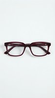 Burgundy acetate eyeglasses with square frames and clear lenses displayed on neutral background. Suitable for eyewear retail, fashion, and optical advertising.
