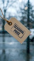 Kraft paper price tag with seasonal price text hanging against rainy window with bokeh background, retail sale and discount concept.