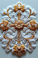 Ornate white and gold embroidered lace applique with floral motifs and decorative swirls isolated on light background for fashion and craft projects.