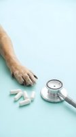 Dog paw with medical stethoscope and pills on light blue background. Veterinary care and pet health concept for animal clinics and healthcare services.