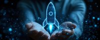 Glowing blue holographic rocket launching from open palms against dark background with particles, symbolizing business startup and innovation success.