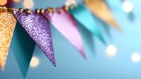 Festive glittery party bunting flags in gold, purple and pink against blurred turquoise background with bokeh lights creating celebratory atmosphere.