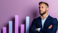 Young confident businessman with crossed arms standing against purple background with growing chart bars, looking at business success and growth.