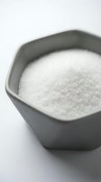 White granulated sugar in gray ceramic bowl on white background, suitable for food photography, cooking, baking, and culinary content.