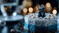 Festive birthday cake decorated with blue sprinkles and whipped cream topped with fantasy warrior figurine against blurred bokeh lights background.