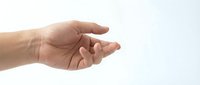 Open male hand reaching out in giving or receiving gesture isolated on white background for business and communication concepts.