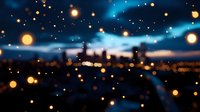 Dreamy urban nightscape with glowing bokeh lights and blurred city silhouette against dark blue sky, creating magical atmosphere for background designs.