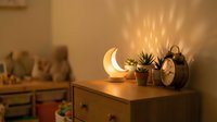 Cozy bedroom nightstand with glowing crescent moon lamp, alarm clock and succulent plant creating warm ambient lighting for relaxation and sleep.