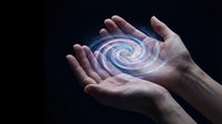 Hands holding glowing energy spiral with magical light effects on dark background for spiritual and mystical concepts.