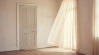 Bright airy room with white door, sheer curtains, and welcome sign on wall, bathed in soft natural light on wooden floor.