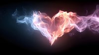 Abstract heart shape formed by colorful flowing smoke against dark background for romantic designs and love concepts.