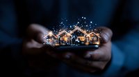Magical glowing houses silhouette floating above cupped hands with sparkles and light particles against dark background, real estate concept visualization.
