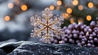 Delicate golden snowflake ornament resting on dark surface with warm bokeh lights and purple berries creating festive winter holiday atmosphere for seasonal decor.
