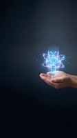 Human hands holding glowing atomic structure with neon light effects on dark background for science and technology concepts.