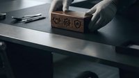 Hands placing wooden block with security icons on modern desk for cybersecurity and data protection business concepts.