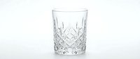 Crystal cut glass tumbler with diamond pattern design isolated on white background for luxury drinkware and elegant dining concepts.