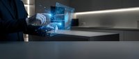 Businessman using futuristic holographic interface technology with digital data visualization in modern office environment for business analytics.