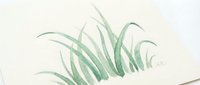 Watercolor grass blades in soft green tones on textured paper background for natural botanical artwork and organic design projects.