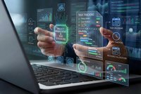Business professional analyzing holographic data dashboard with charts, graphs and analytics emerging from laptop screen for digital transformation.