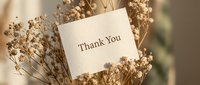 Thank you card nestled among dried wildflowers in warm beige tones, elegant minimalist style for greeting, wedding, or appreciation design.