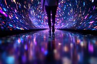 Silhouette of person walking through tunnel with spectacular light show creating colorful reflections on wet floor, purple and blue neon lights bursting outward.